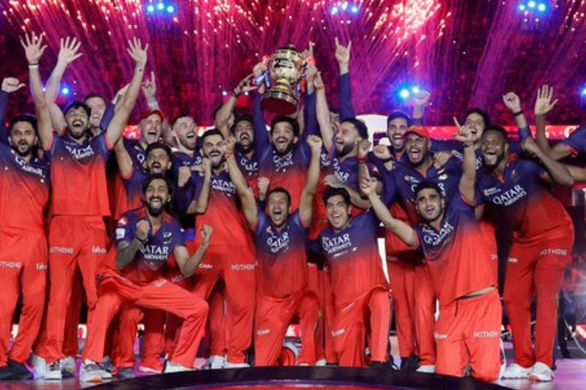 RCB IPL 2025 Champions: Virat Kohli, Rajat Patidar, and team celebrate with the trophy, a historic moment of victory.