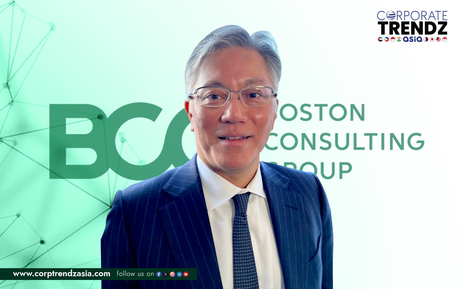 A professional headshot of Yasushi Sasaki, a man in a business suit, looking contemplative and confident, suitable for a leadership announcement.