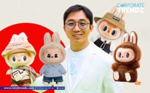 Wang Ning, founder of Pop Mart, with a collection of Labubu dolls, showcasing his journey from toy seller to billionaire.