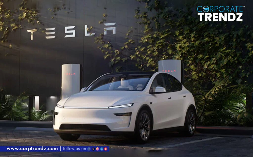 The sleek front of a Tesla Model Y, prominently displayed within a modern showroom, with the Tesla logo visible.
